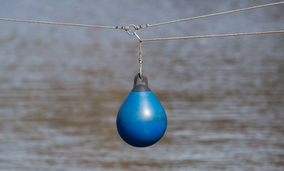 Naklejka na ściany i meble BLue buoy hanging out to dry