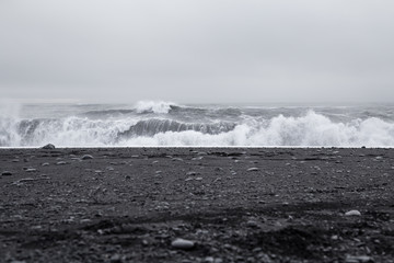 Waves in the beautiful volcanic black sand beach in Dyrholaey near Vik, Iceland.  