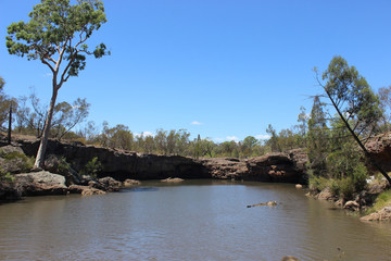 Fototapeta na wymiar Creek with bank and rocks