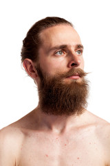 Obraz premium Cool hipster with long beard over white background in studio photo