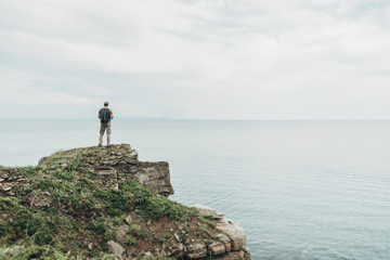 Traveler walking on high coas