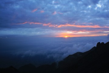 sun rises over the sky. view in the top of mount merapi