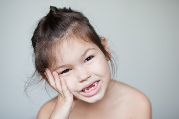 The child dropped the first milk tooth