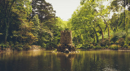 Castel tower in a lake at Park of Pena, Sintra, Portugal