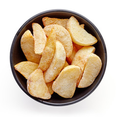 Bowl of frozen potato wedges isolated on white background, top view
