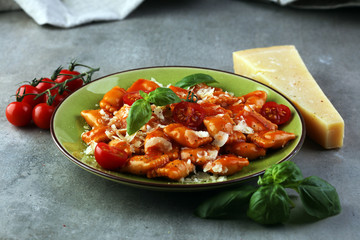 Ravioli with tomato sauce and basil