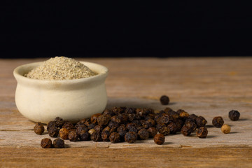 black pepper on old wooden