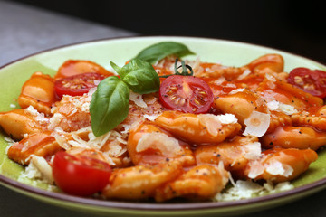 Ravioli with tomato sauce and basil