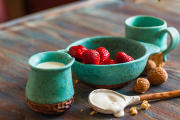 strawberries, granola with fresh yogurt for healthy breakfast. Copyspace