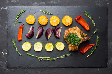 Grilled meat with vegetables on the pan. Selective focus.