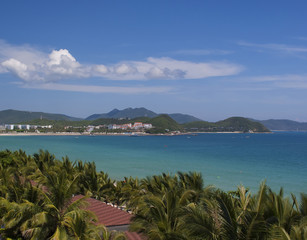 A city on an island in China. The home of the ocean and palm trees
