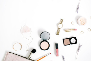 Beauty blog concept. Professional female make up accessories: watches, necklace, lipstick, brush, powder on white background. Flat lay, top view trendy fashion feminine background.