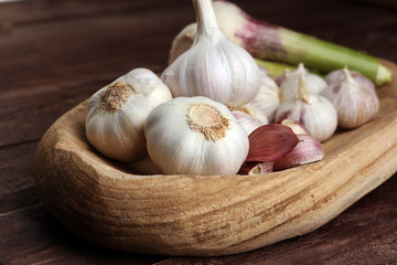 Garlic. Garlic Cloves and Garlic Bulb in vintage wooden bowl.