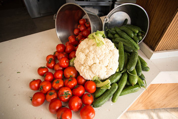 Composition with tomatoes, cucumbers and cauliflower.