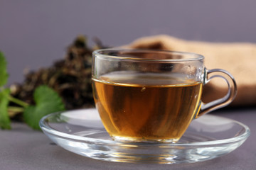 Herbal dry sri lanka tea. Mint leaf. Tea in a glass cup, mint leaves, dried tea, in a restaurant or teahouse