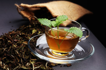 Herbal dry sri lanka tea. Mint leaf. Tea in a glass cup, mint leaves, dried tea, in a restaurant or teahouse