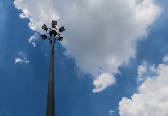 Pillar spotlights on blue sky background
