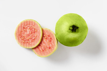 Fresh halves pink guava isolated on white background