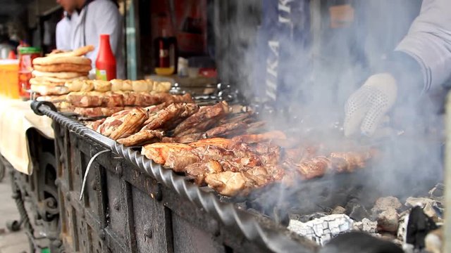 Preparing tasty shashlik at open-air restaurant in Moscow, Russia 