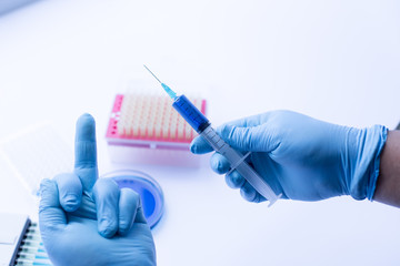 Expressing feelings by hand when experimental research analysis in laboratory.