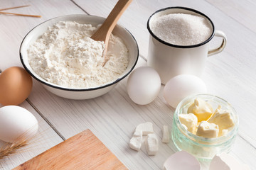 Baking ingredients on rustic wood background