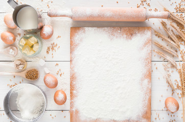 Baking ingredients on white rustic wood background, copy space