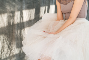 woman with blowed dress by wind. sunny dance studio © sibstock