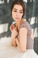 woman with blowed dress by wind. sunny dance studio © sibstock