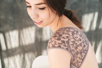 woman with blowed dress by wind. sunny dance studio © sibstock