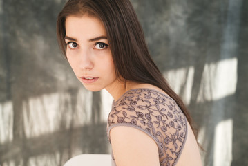 woman with blowed dress by wind. sunny dance studio © sibstock