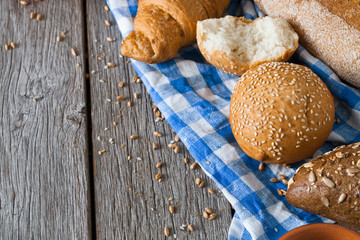 Bread background with copy space on rustic wood