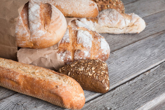 Bread background with copy space on rustic wood