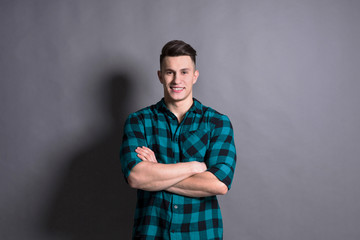 Young handsome man studio portrait, boy style