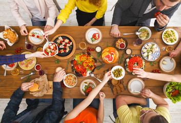 People eat healthy meals at served table dinner party