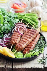 
    Kebab .Traditional meat kebab of minced beef or lamb with vegetables and herbs .Selective focus 