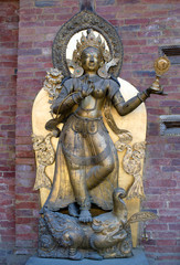 Fototapeta na wymiar Ancient statue in Royal Palace at Mul Chowk in Patan, Kathmandu Valley, Nepal