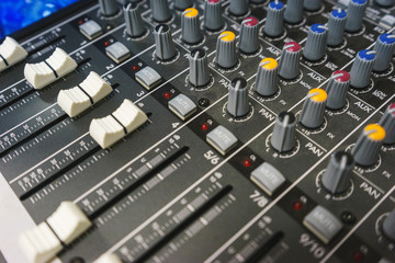 Sound equipment for a nightclub, discotheque or recording studio. The mixing console of the sound engineer in operation. 