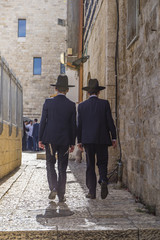 Alley in Jerusalem old city with two orthodox boys walking away