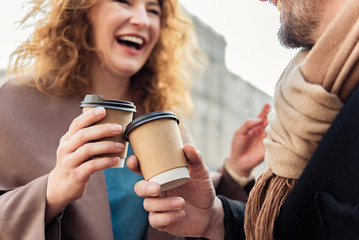 Cheerful man and woman drinking hot beverage © Yakobchuk Olena
