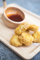 Crispy chicken nuggets with sauce. Selective focus