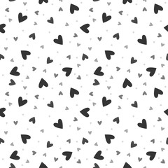 Vector seamless pattern with chaotic hearts.