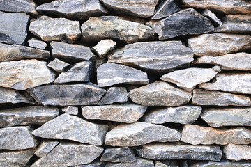 stack of old gray stone wall, for background or texture