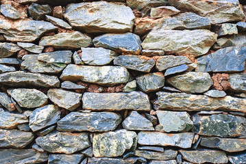 stack of old gray stone wall, for background or texture