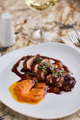 Duck breast Magret with mashed nutmeg pumpkin dressed with porto sauce