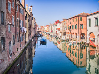 Fototapeta na wymiar Characteristic canal in Chioggia, lagoon of Venice.