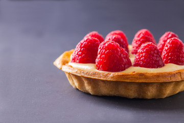 Tartlets with custard, raspberry