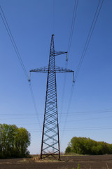 High voltage power line against blue sky