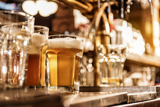 Glass of cold alcohol beverage on desk