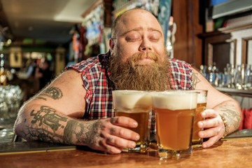 Man hugging alcohol in bar