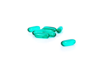 green pills medicine on white background